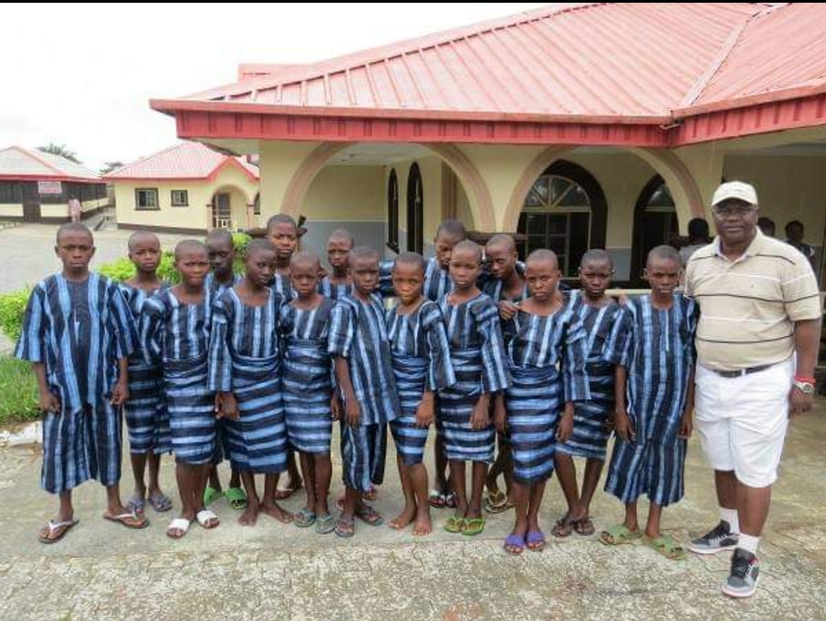 Students enjoying their free daily meal at Abolarin College